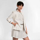 A model wearing seasonal white active jacket with pleated back - عارضة أزياء ترتدي سترة بيضاء رياضية ذات ظهر مطوي