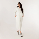 A model wearing a buttoned maxi sweatshirt dress with collars in a beige color - عارضة أزياء ترتدي فستان ماكسي بياقات وأزرار باللون البيج