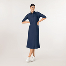 A model wearing knee covering polo dress in a seasonal navy color - عارضة أزياء ترتدي فستان بولو يغطي الركبة باللون الأزرق البحري