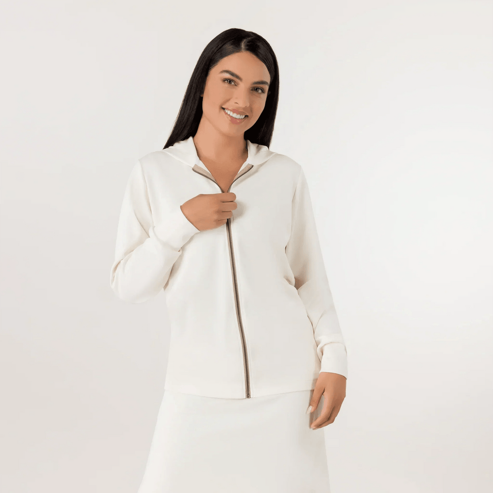 A model in a seasonal beige zipped sweatshirt paired with a skirt - عارضة أزياء ترتدي سترة رياضية ناعمة باللون البيج مع تنورة