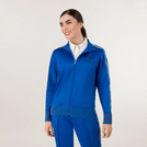A model in seasonal blue track set printed with Kayanee logo - عارضة أزياء ترتدي طقم رياضي باللون الأزرق مطبوعًا عليه شعار كياني