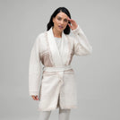 A model wearing seasonal white midi wrap cardigan - عارضة أزياء ترتدي كارديجان باللون الأبيض متوسط الطول
