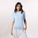 A model wearing a half sleeve knit sweater in a light blue color - عارضة أزياء ترتدي سترة محبوكة نصف كم باللون الأزرق الفاتح