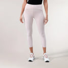 A model wearing Freestyle light pink cropped leggings with a high-waisted fit - عارضة أزياء ترتدي ليقنز "فري ستايل" قصير باللون وردي فاتح بقصة خصر عالية