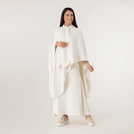 A model wearing seasonal beige soft cape - عارضة أزياء ترتدي كاب ناعم باللون البيج الموسمي