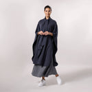 A model wearing trendy seasonal black soft cape from Kayanee - عارضة أزياء ترتدي عباءة عصرية ناعمة من كياني باللون الأسود
