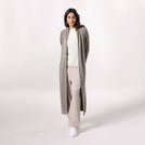 A model in a seasonal taupe maxi sweater - عارضة أزياء ترتدي سترة ماكسي باللون بني فاتح