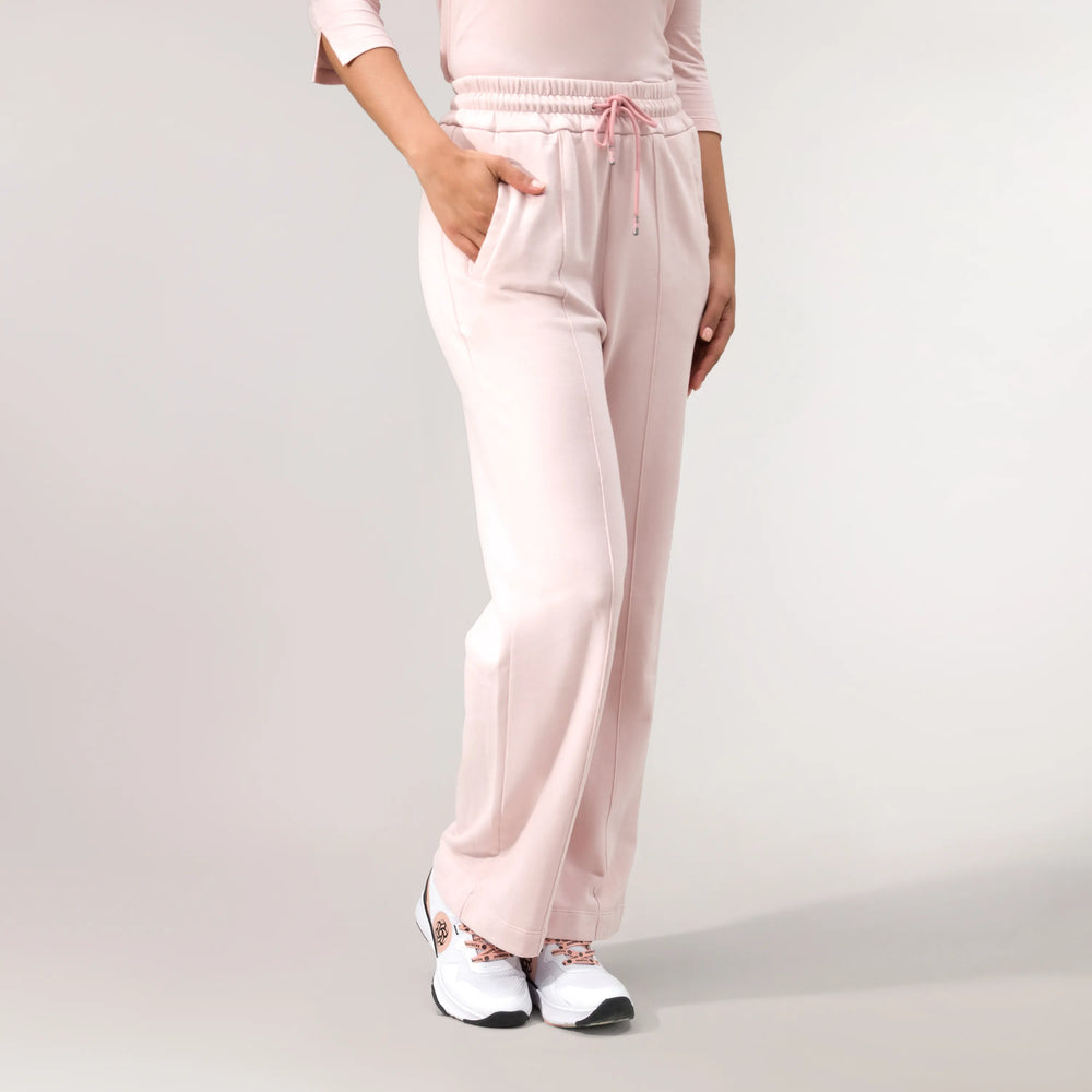 Light pink flared track pants with elastic waistband - بنطال رياضي واسع باللون الوردي الفاتح مع حزام خصر مطاطي