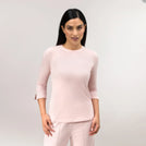 A model wearing a core light pink "Easybend" top - عارضة أزياء ترتدي توب "إيزي بند" باللون الوردي الفاتح