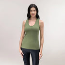 A model wearing a musk green "Easybend" tank top with a scoop neck - عارضة أزياء ترتدي توب "إيزي بند" أخضر بدون أكمام بياقة دائرية