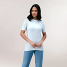 A model wearing a "Limber Up" t-shirt in a core light blue - عارضة أزياء ترتدي تيشيرت "ليمبر آب" رياضي أزرق فاتح اللون