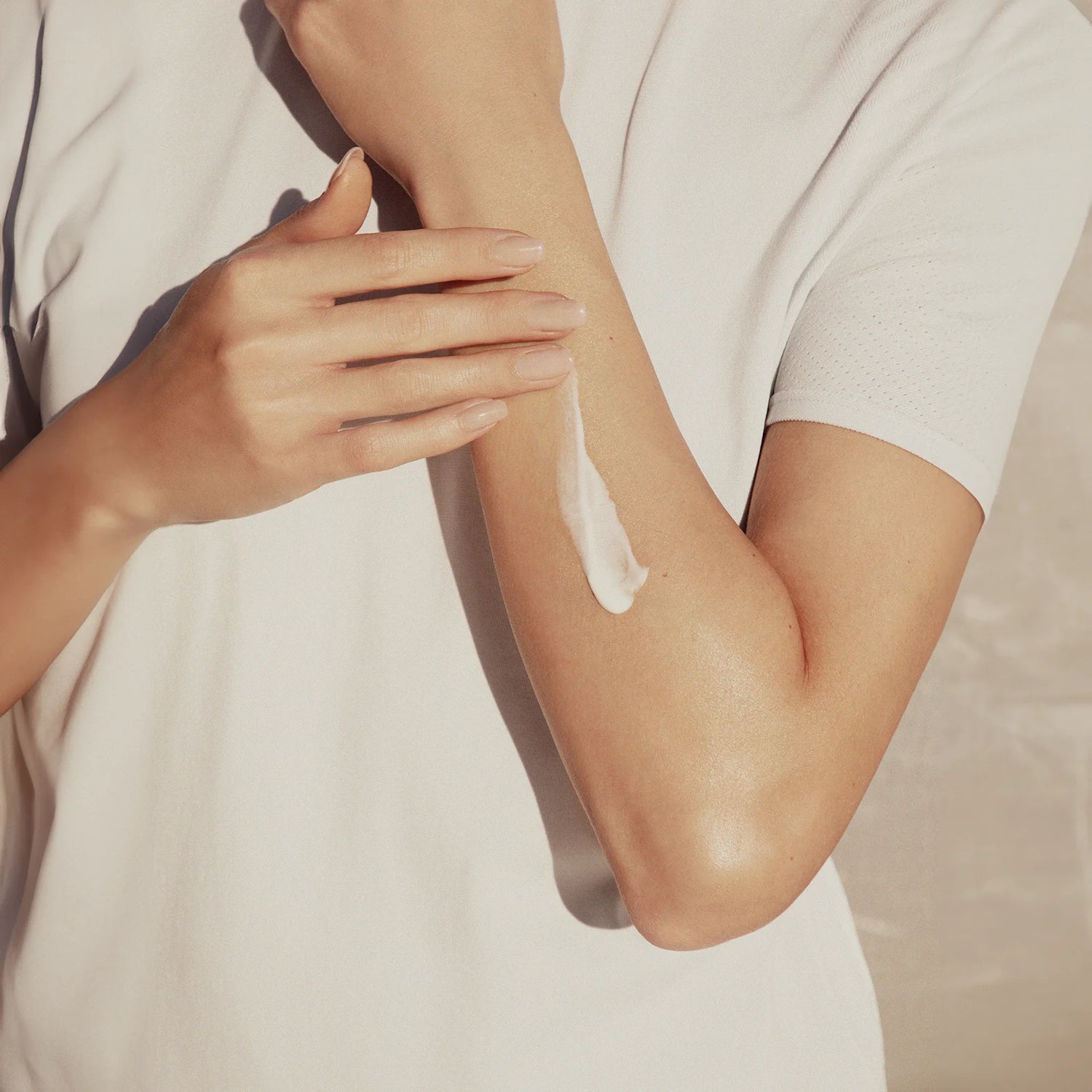 A girl applies hand cream from Kayanee's bodycare products