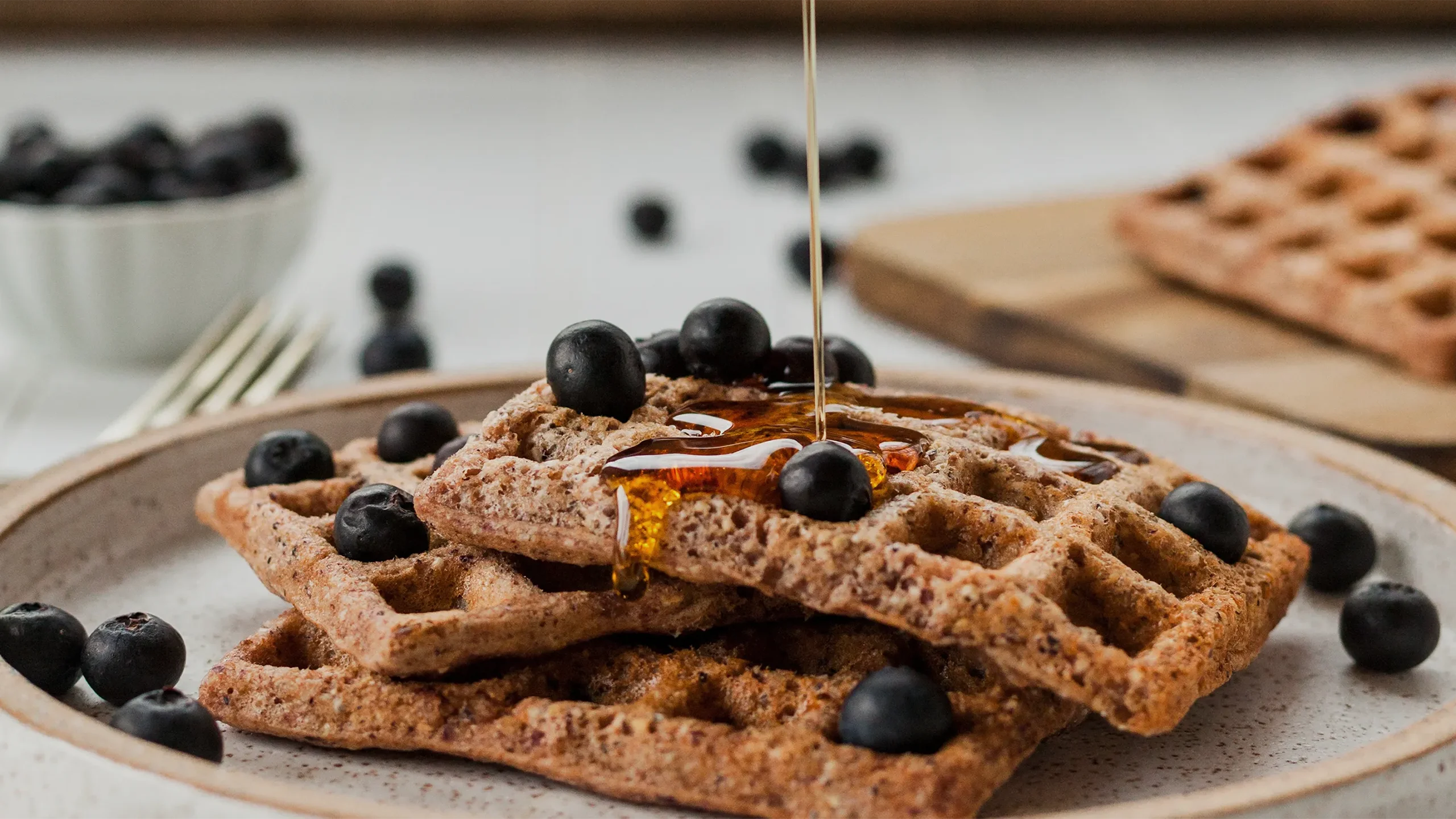 Healthy waffle topped with blueberries and honey, Kayanee KSA