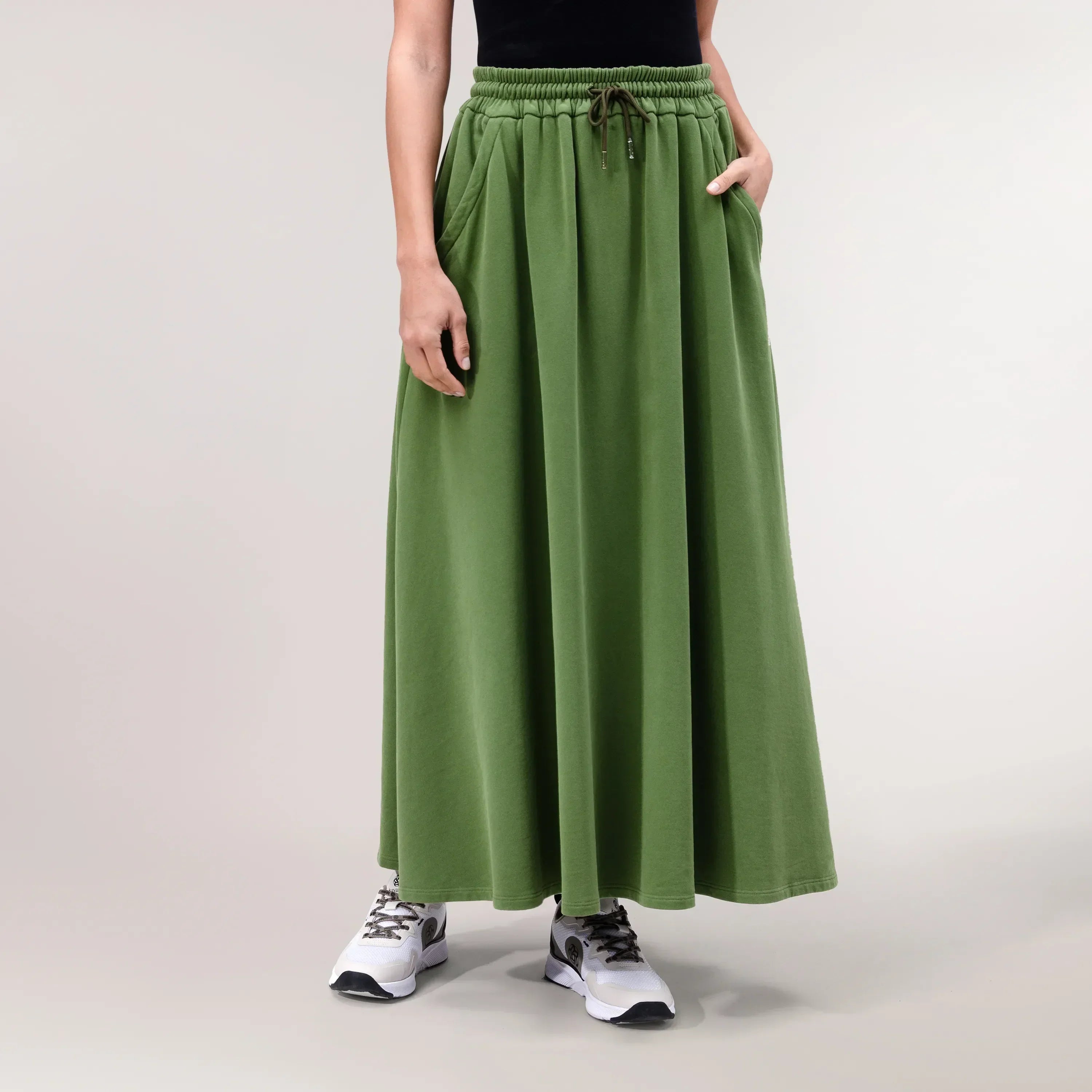 Dark musk green skirt with flared, sporty cut - تنورة خضراء مسكية داكنة بقصة رياضية واسعة
